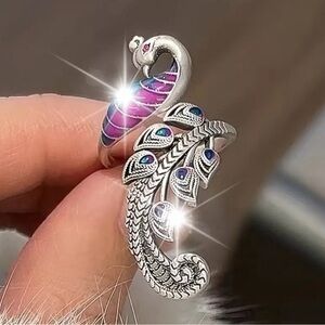 Elegant Silver Peacock Ring with Purple Accents.